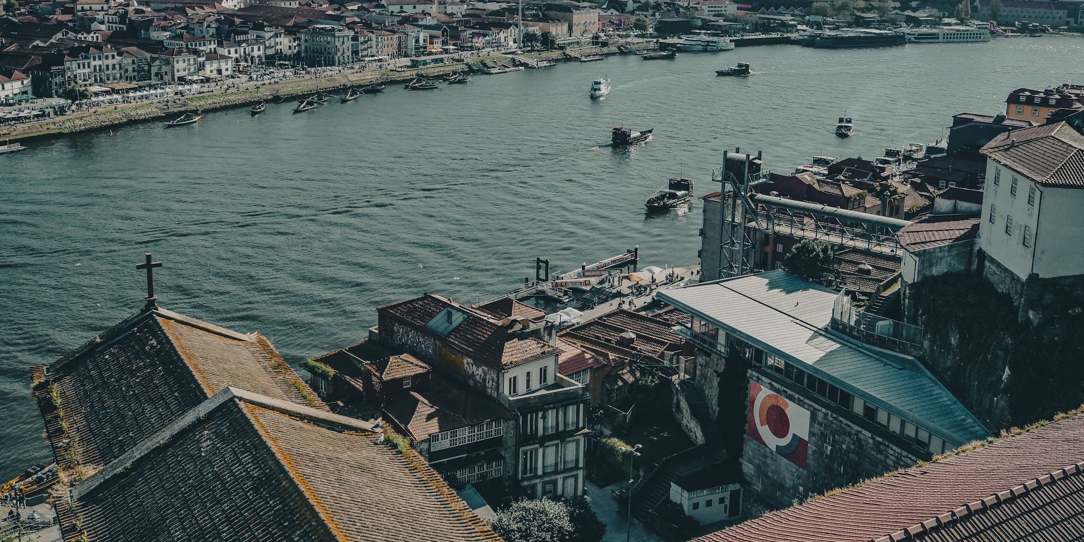 Riverside rooftops and boats in Porto, Portugal photographed by Eugene Truuts