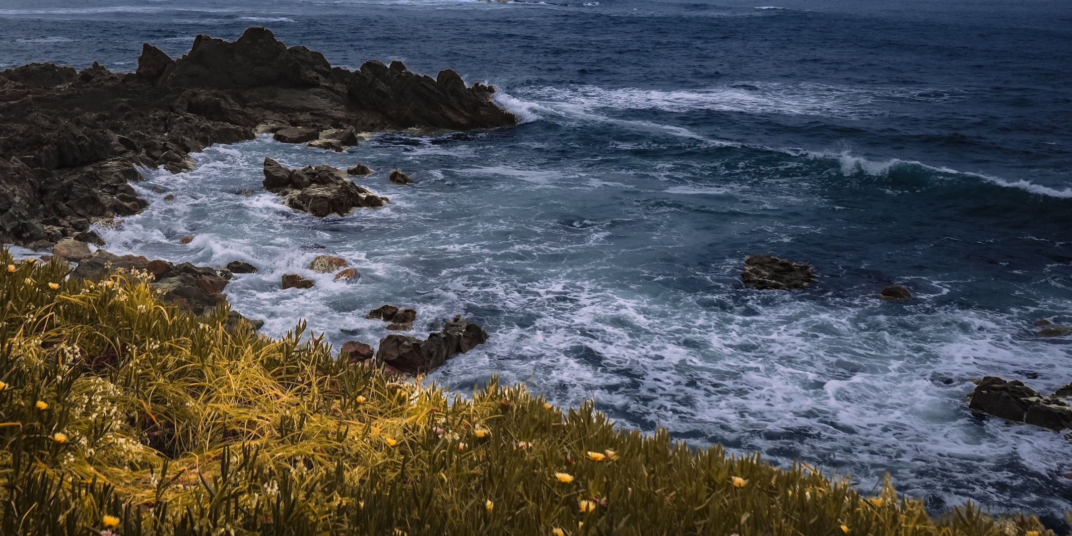 Atlantic waves breaking against a rocky coast photographed by Eugene Truuts